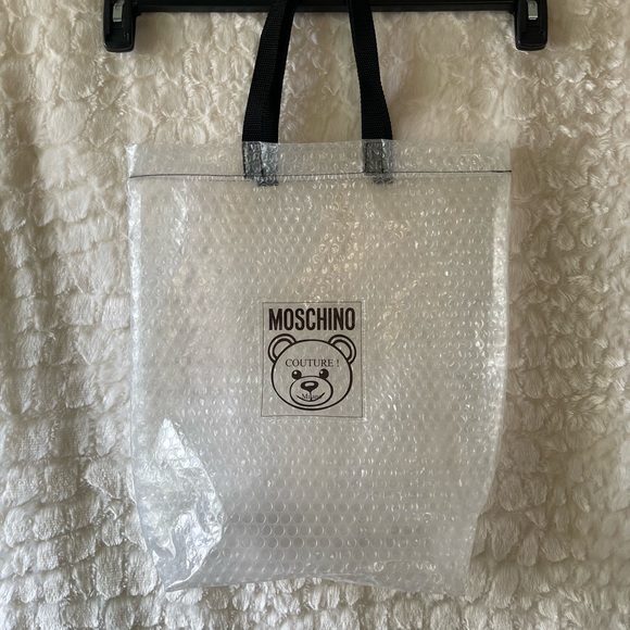 Moschino Accessories - MOSCHINO Teddy couture Milano clear bubble shoe dust bag, with black handles.